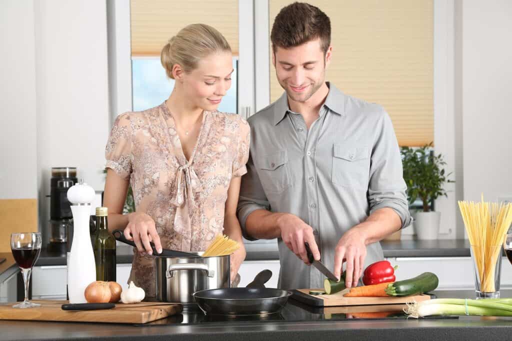man and woman in kitchen
